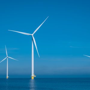 Huge windmill turbines, Offshore Windmill farm in the ocean Westermeerwind park , windmills isolated at sea on a beautiful bright day Netherlands Flevoland Noordoostpolder